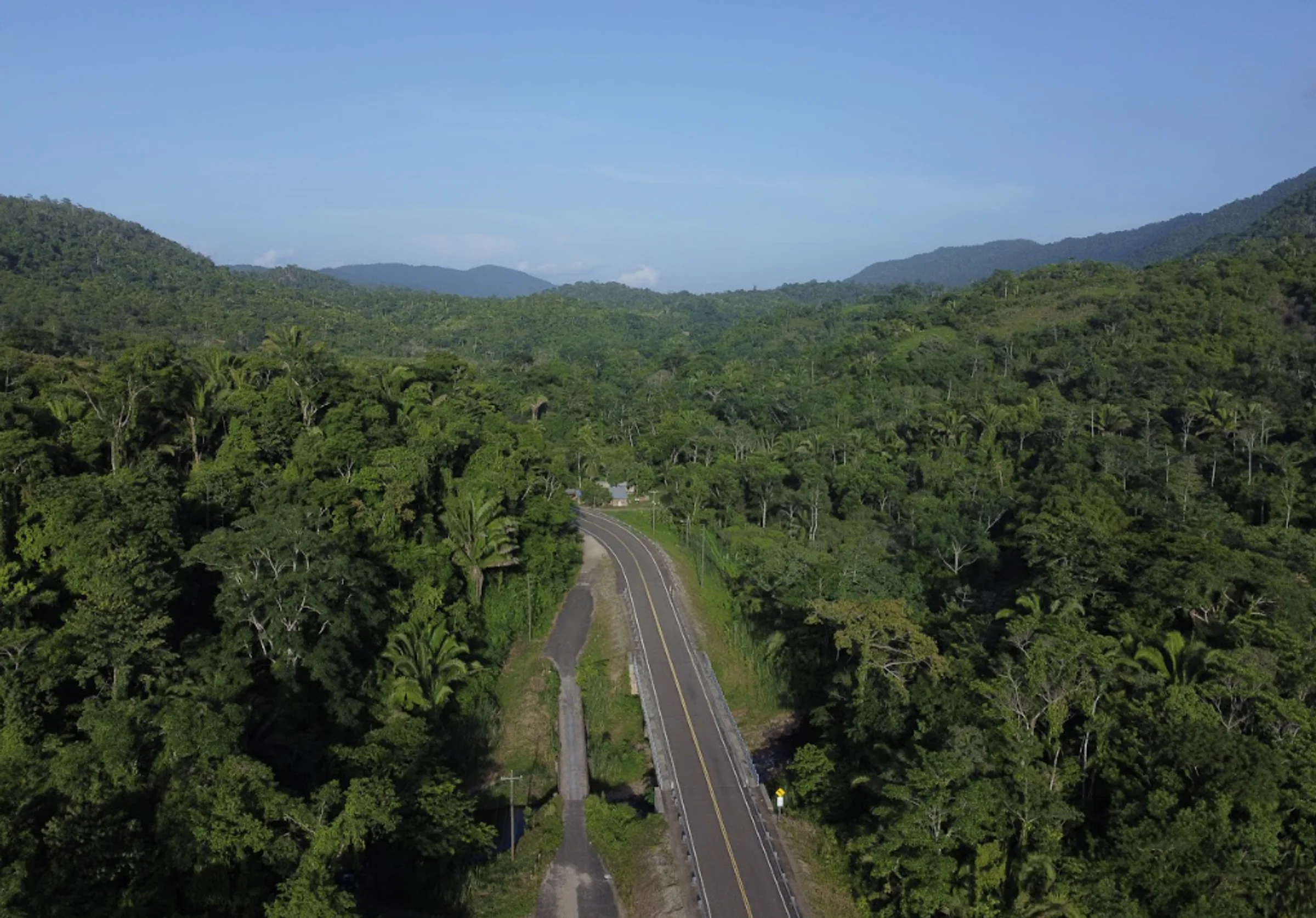 Highway through inland Belize jungle and hills